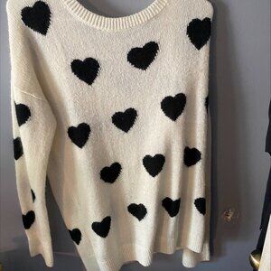 Express Womens  cream colored shirt with black hearts-Gently used-Size Large